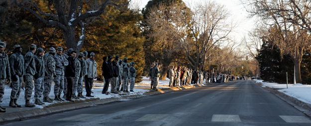 Photograph of troops waiting for Air Force Capt David Lyon's military cortege to pass by.